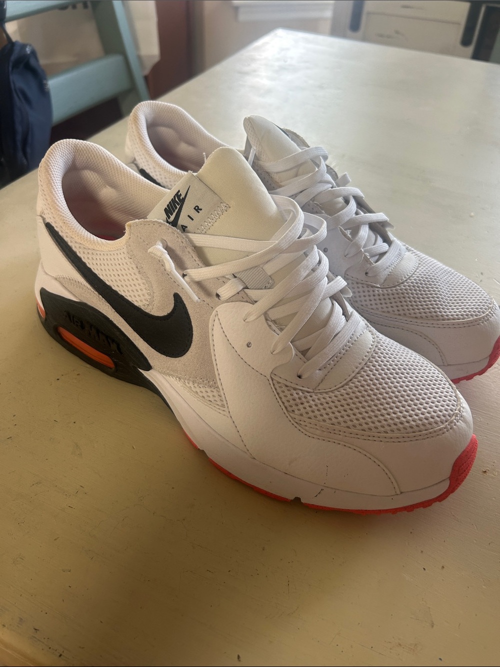 Mens Nike White Sneakers with Black Swoosh and Orange Accents